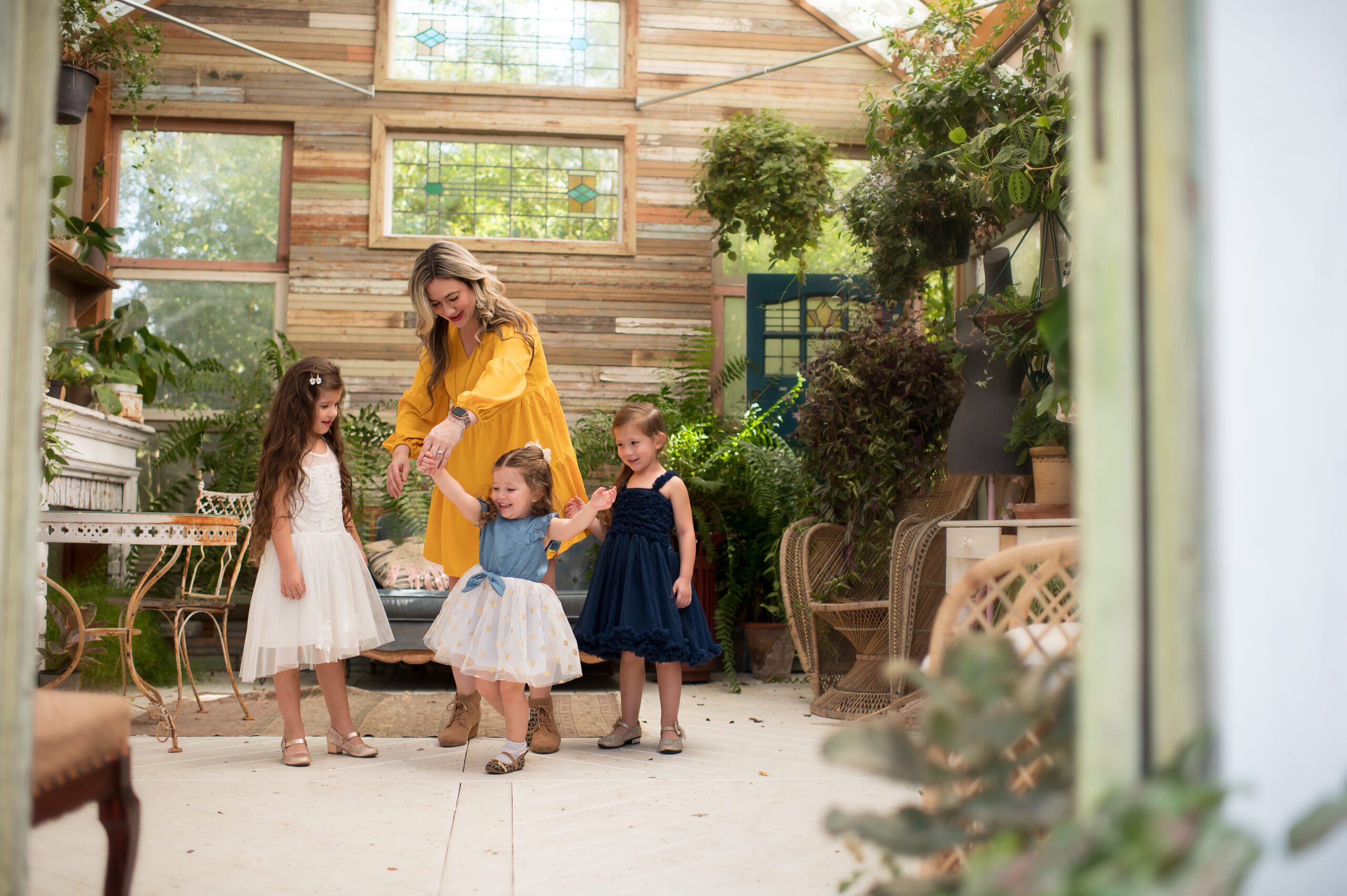 Mom and daughters dancing