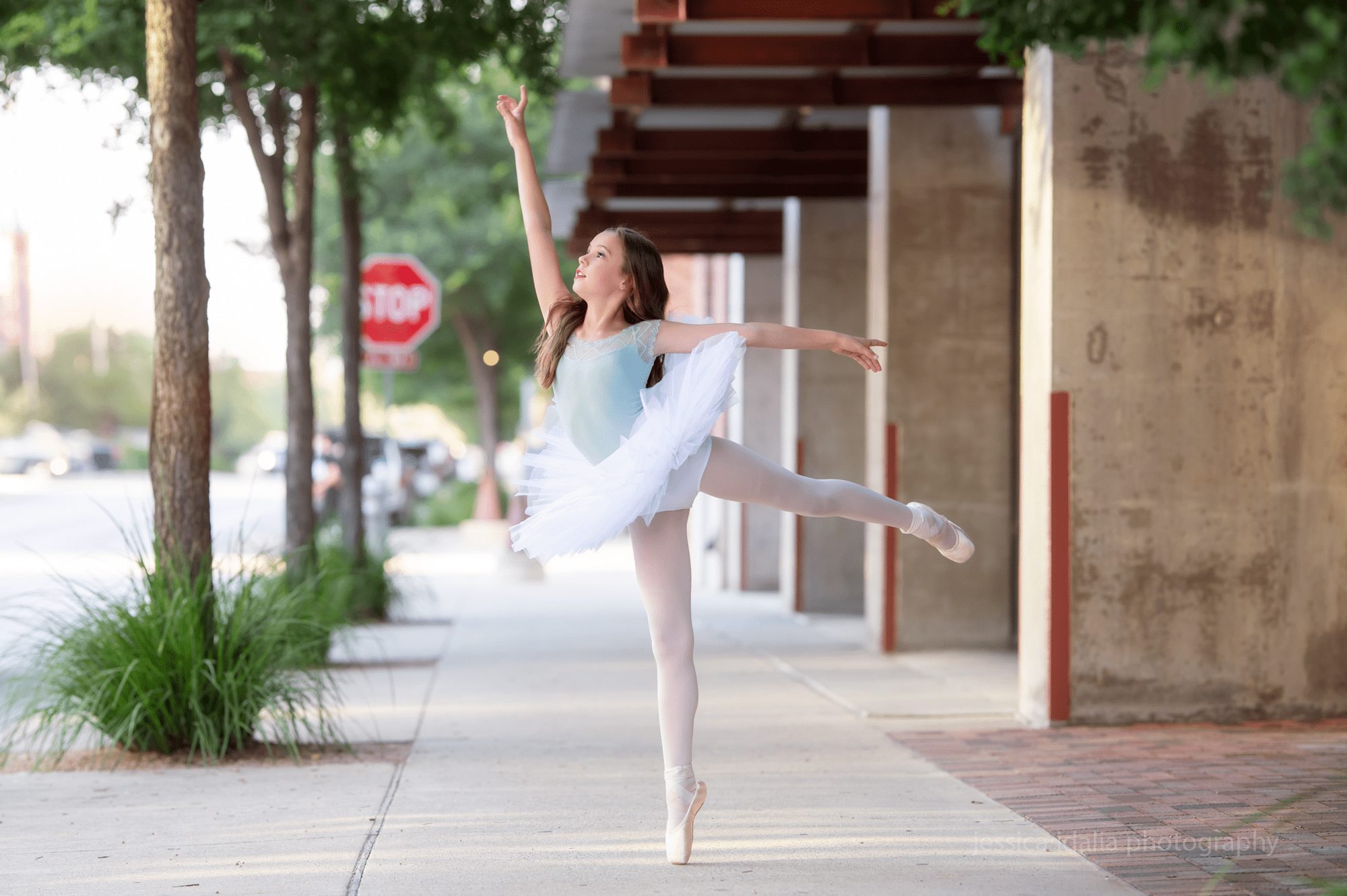 Ballerina portrait dancing in the sidewalk 