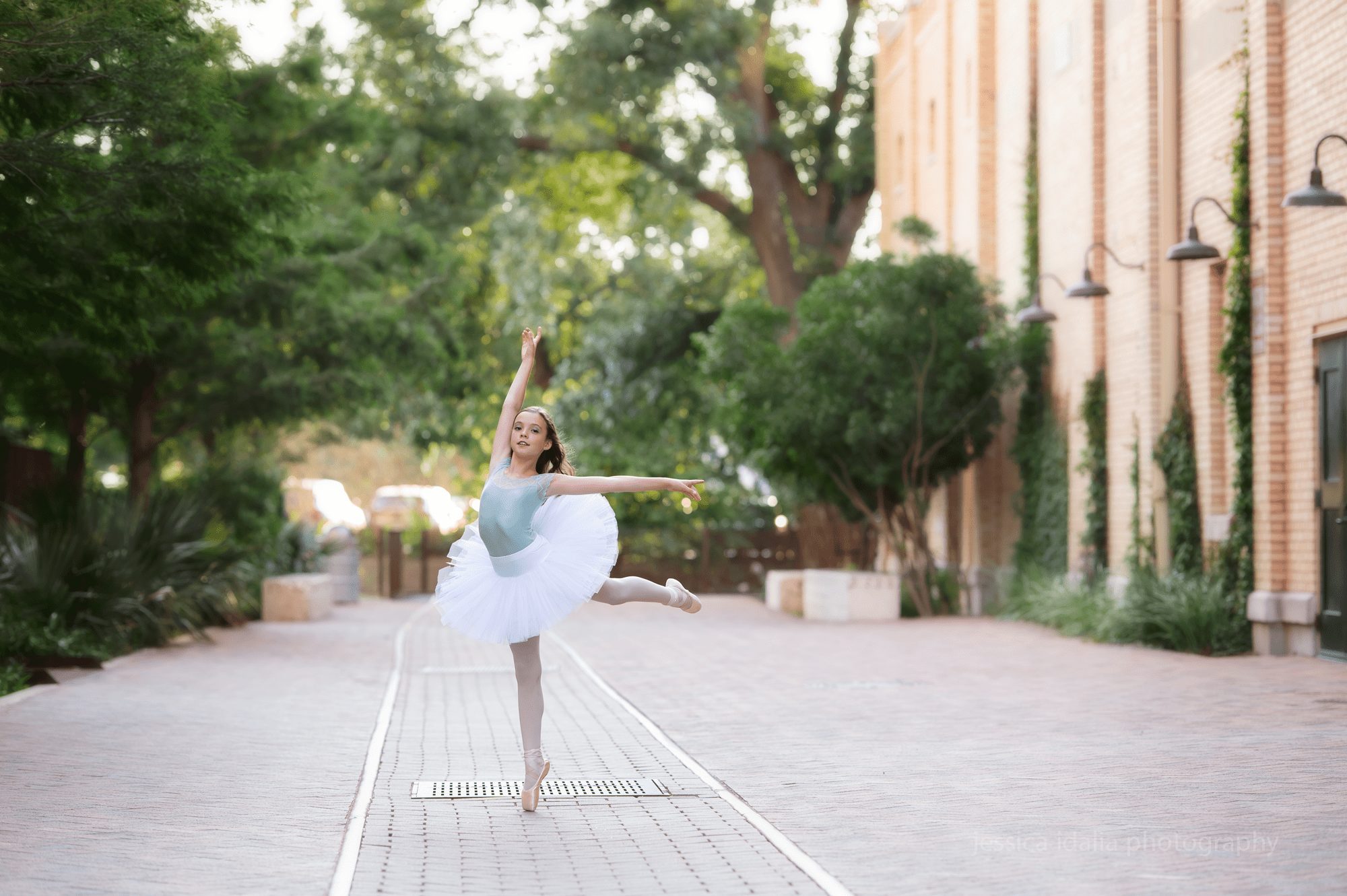 Ballerina portrait dancing in front of building