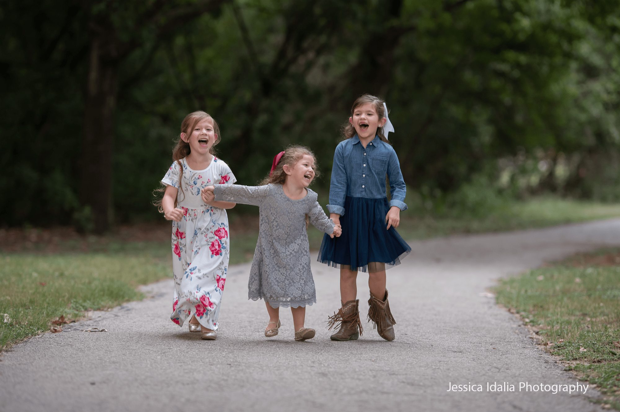 Three sisters walking in park