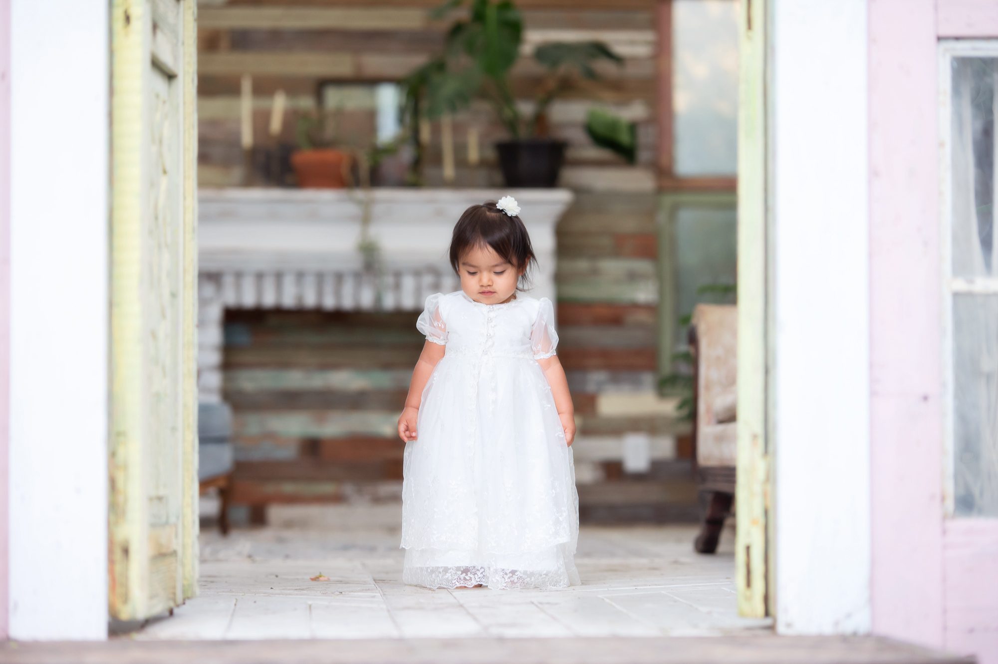 little girl in greenhouse