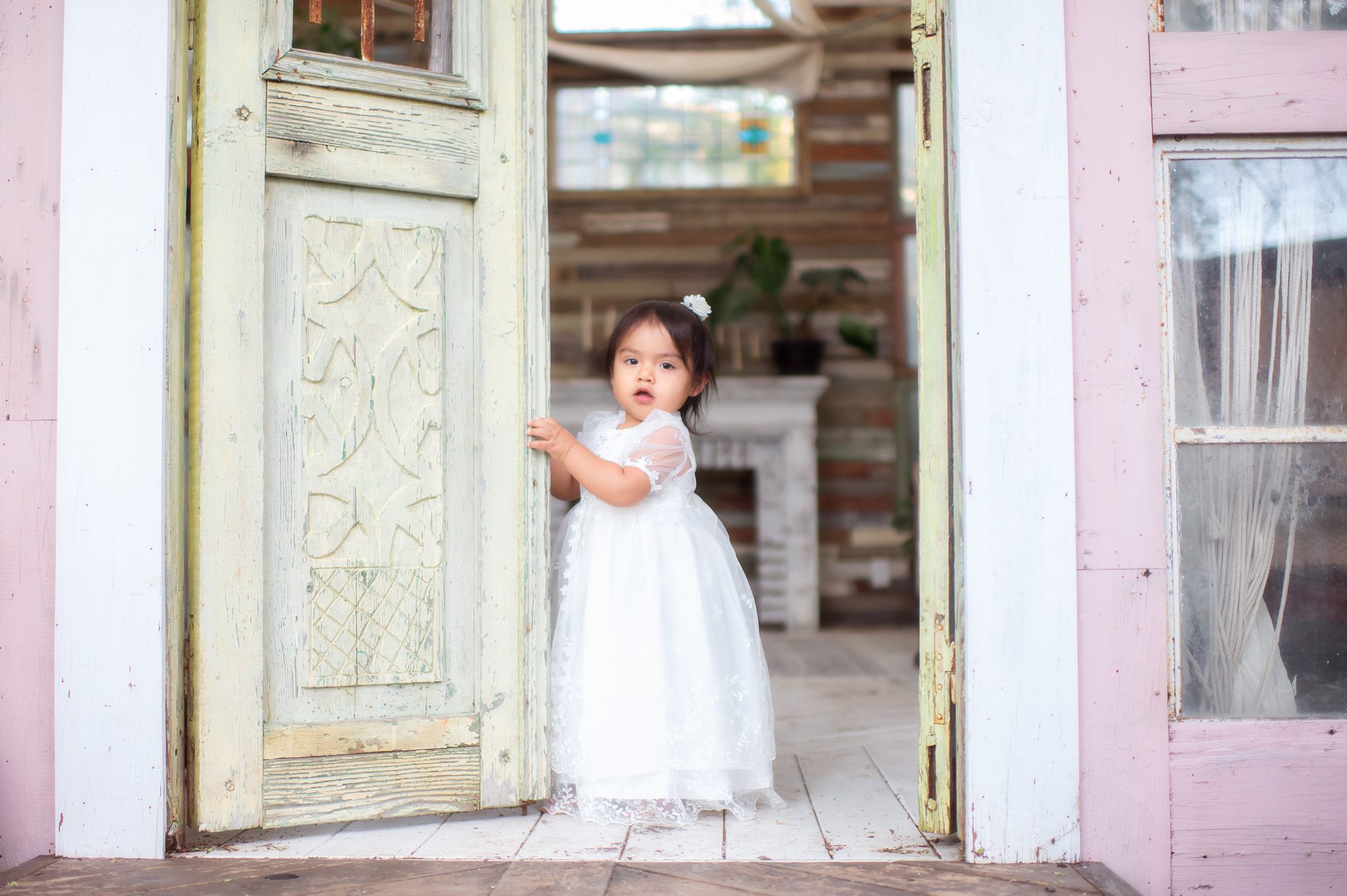 little girl standing at the door