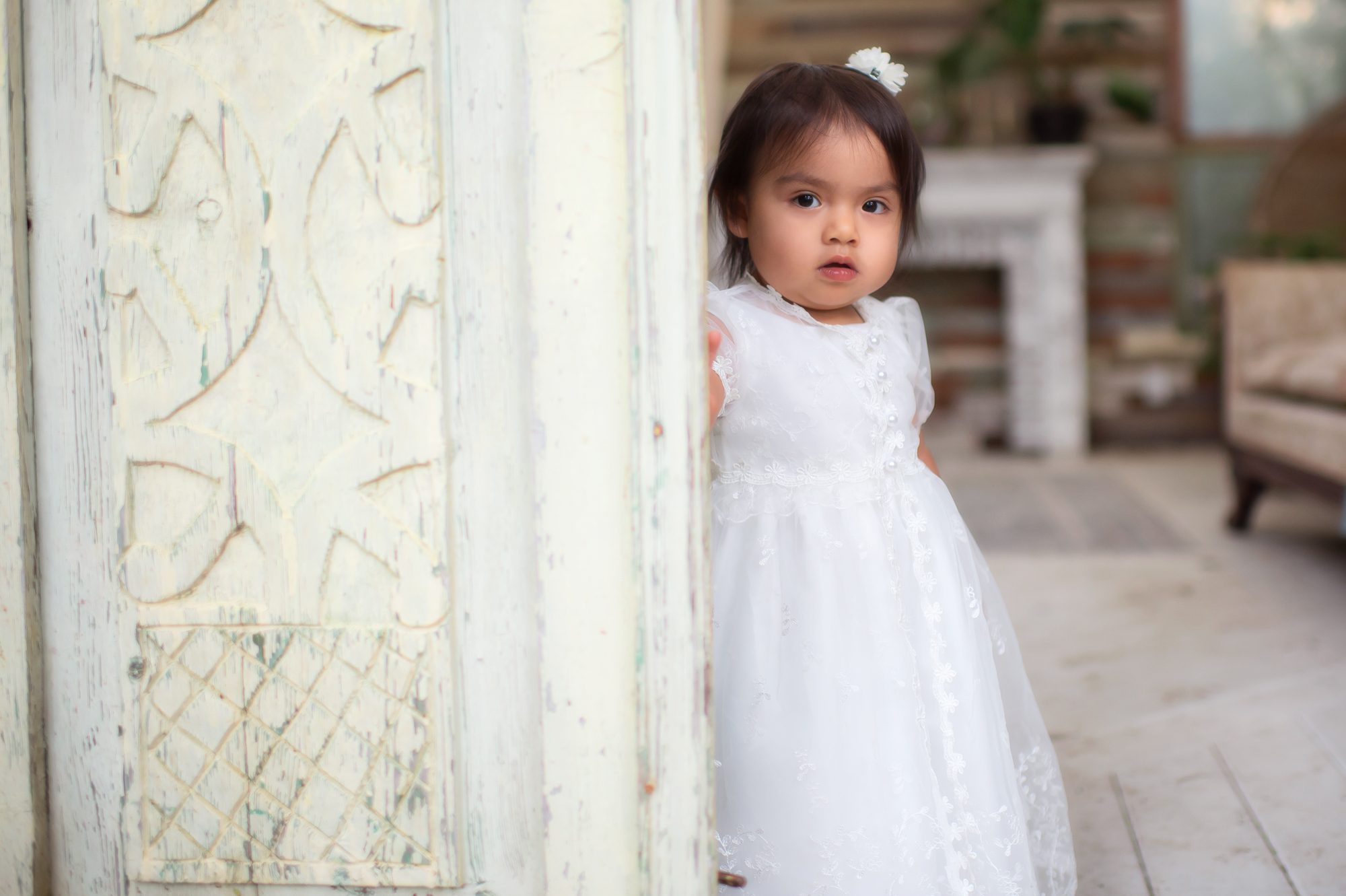 child opening greenhouse door